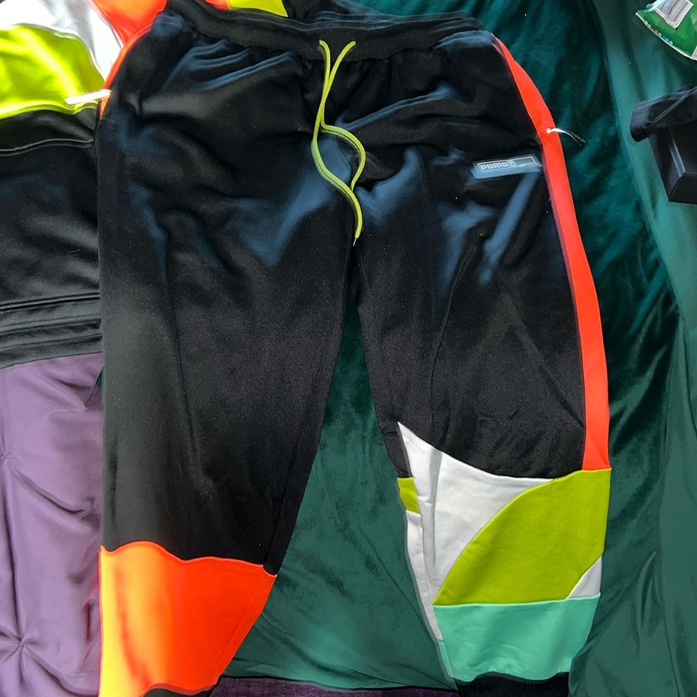 Puma multicolored track pants. Great condition
